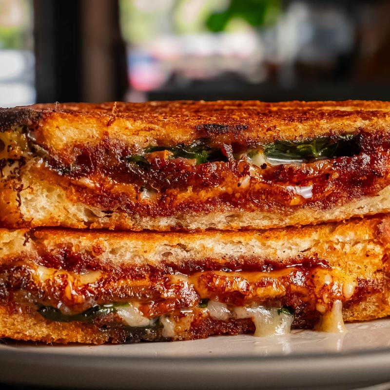 Grilled cheese halves with crisp, golden edges